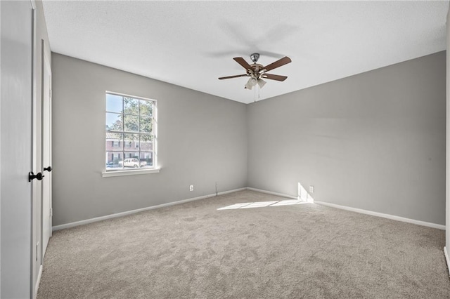 empty room with carpet floors and ceiling fan