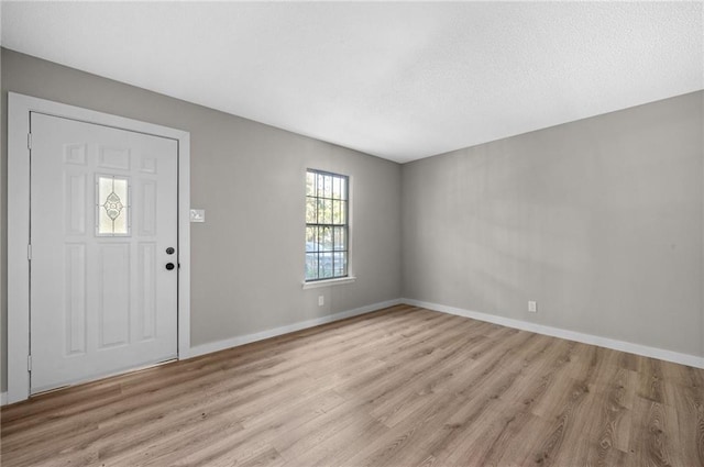 foyer entrance with light hardwood / wood-style floors