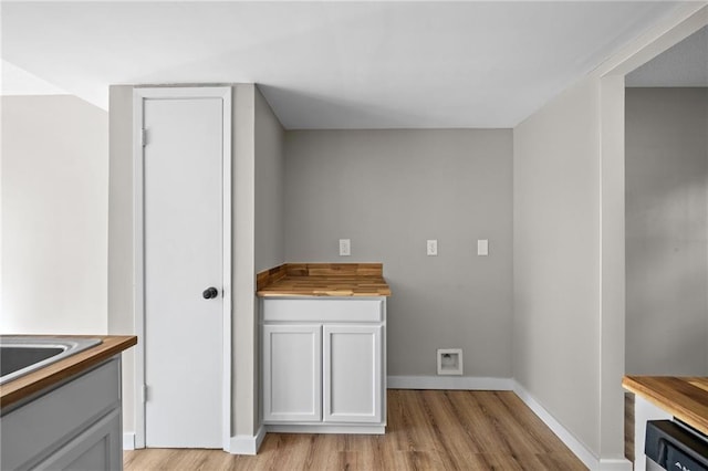 laundry room featuring light hardwood / wood-style flooring