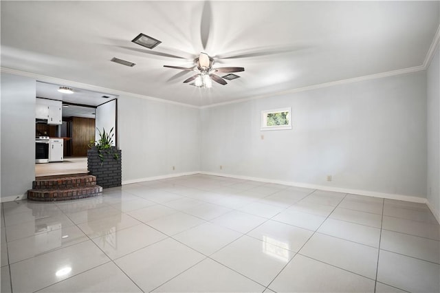 tiled spare room featuring crown molding and ceiling fan