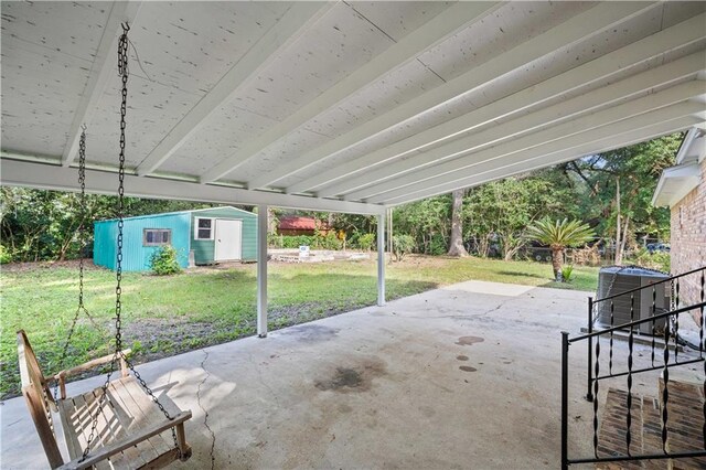 view of patio featuring a storage shed