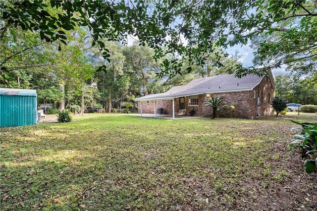 view of yard with a patio area