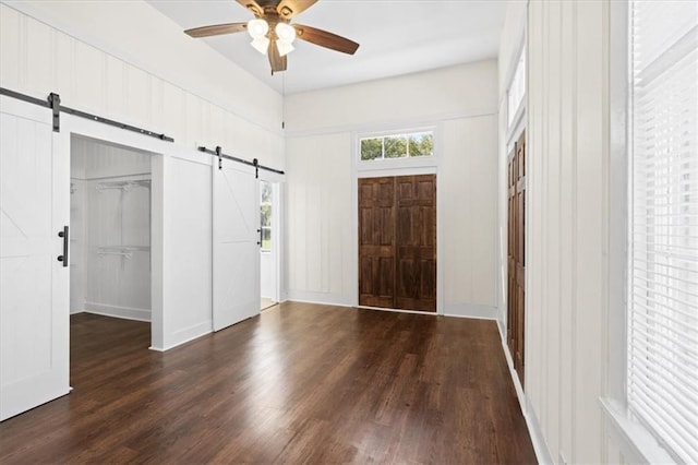 1012 Texas St, Mobile, AL 36604 - entryway featuring a barn door, ceiling fan, and wood finished floors