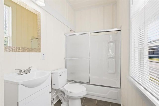 1012 Texas St, Mobile, AL 36604 - full bathroom featuring toilet, tile patterned floors, bath / shower combo with glass door, and vanity