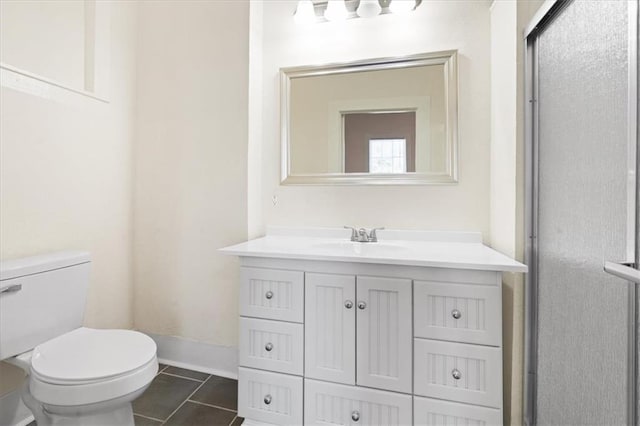 1012 Texas St, Mobile, AL 36604 - bathroom featuring tile patterned flooring, vanity, toilet, and baseboards