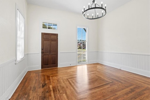 1012 Texas St, Mobile, AL 36604 - entrance foyer with wainscoting, a chandelier, and a wealth of natural light
