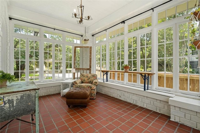 264 Mcdonald Ave, Mobile, AL 36604 - sunroom featuring tile patterned flooring and a chandelier