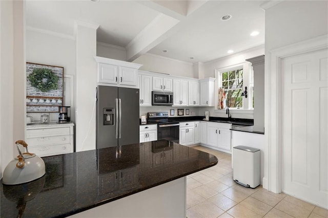 264 Mcdonald Ave, Mobile, AL 36604 - kitchen with appliances with stainless steel finishes, ornamental molding, white cabinets, light tile patterned floors, and recessed lighting