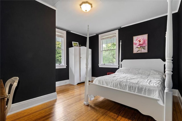264 Mcdonald Ave, Mobile, AL 36604 - bedroom featuring multiple windows, wood finished floors, and crown molding