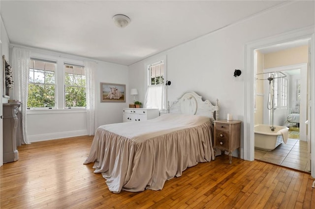264 Mcdonald Ave, Mobile, AL 36604 - bedroom with light wood-style flooring and baseboards