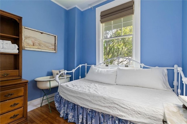 264 Mcdonald Ave, Mobile, AL 36604 - bedroom featuring dark wood-style flooring and crown molding