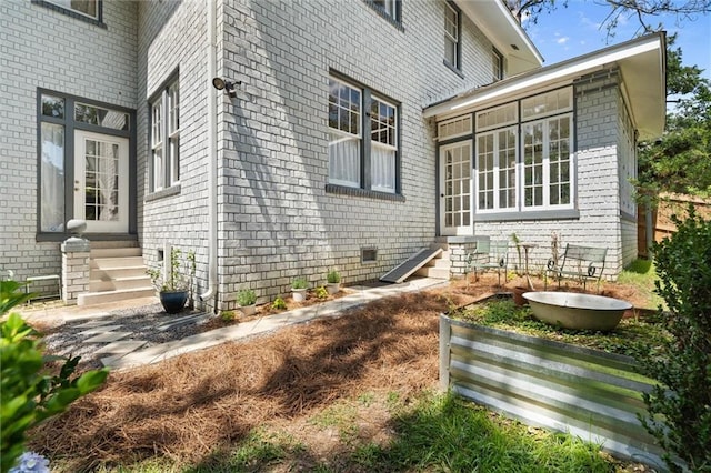 264 Mcdonald Ave, Mobile, AL 36604 - view of home's exterior featuring entry steps and brick siding