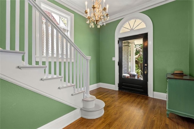 264 Mcdonald Ave, Mobile, AL 36604 - entryway featuring stairway, plenty of natural light, a chandelier, wood finished floors, and ornamental molding