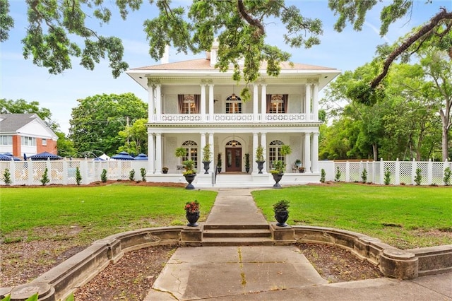 1410 Government St, Mobile, AL 36604 - greek revival inspired property featuring a front lawn, a balcony, and a porch