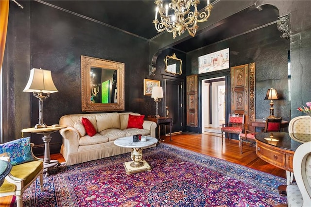 living room featuring a chandelier and wood-type flooring