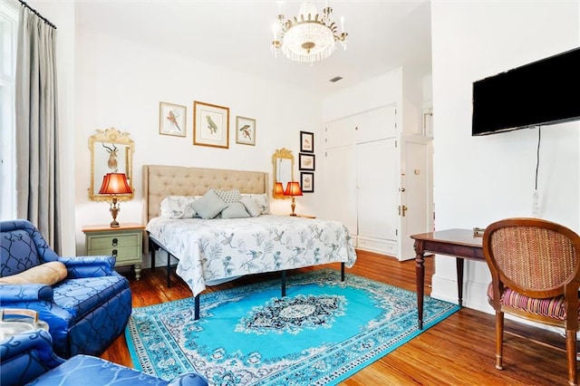 bedroom with hardwood / wood-style floors