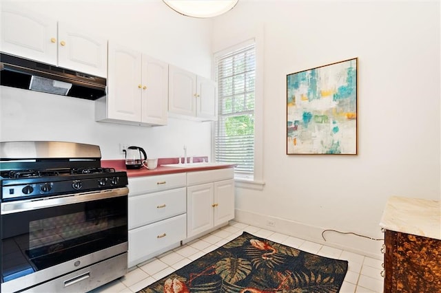 kitchen with white cabinetry, stainless steel range with gas cooktop, and range hood