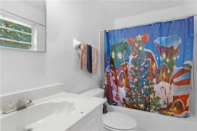 full bathroom with vanity, toilet, and shower / bath combo with shower curtain