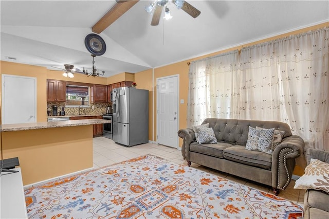 living room featuring vaulted ceiling with beams, ceiling fan, sink, and light tile patterned floors