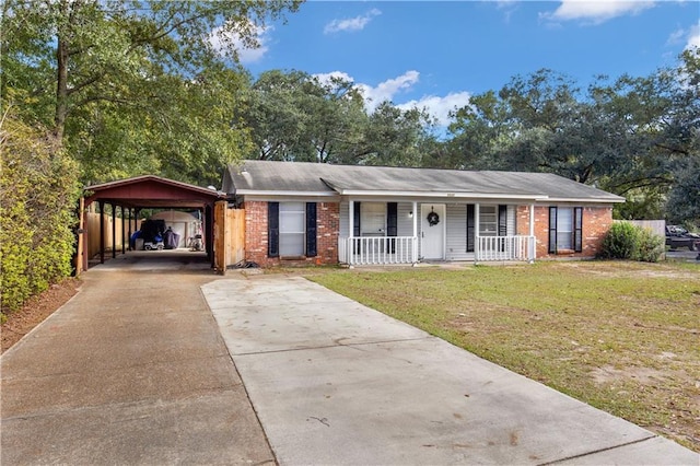 ranch-style home with a front yard, a carport, and covered porch