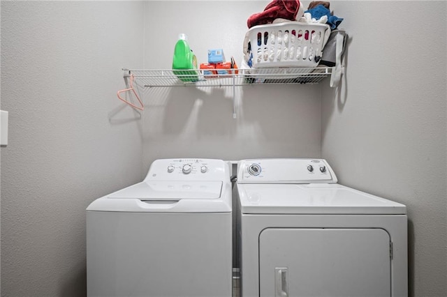 laundry room featuring washing machine and clothes dryer