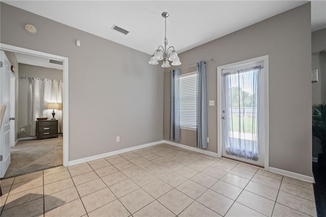 interior space featuring a notable chandelier and light tile patterned floors