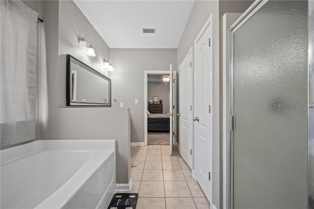 bathroom with tile patterned flooring, ceiling fan, and separate shower and tub