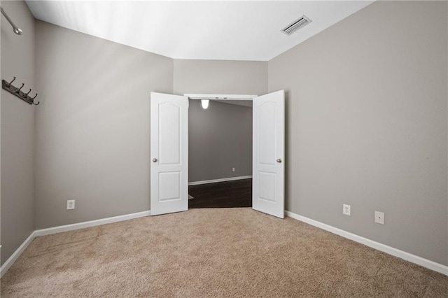 unfurnished bedroom featuring carpet floors