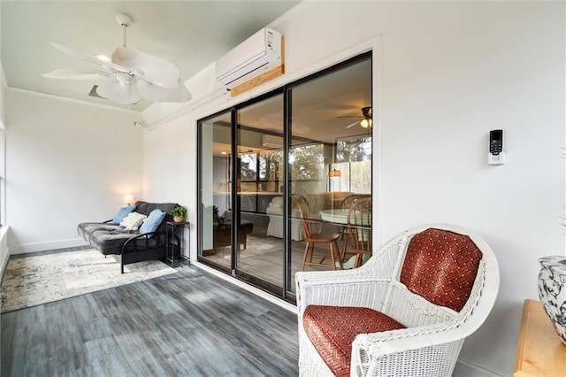 interior space with a ceiling fan and a wall mounted air conditioner