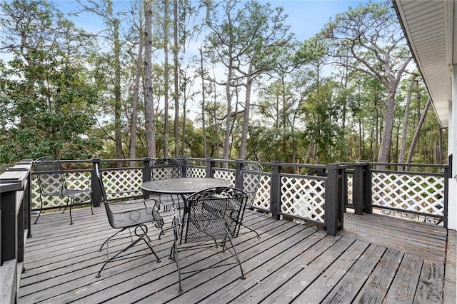 wooden terrace with outdoor dining area