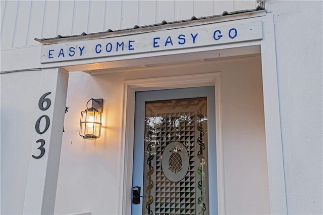 entrance to property featuring board and batten siding