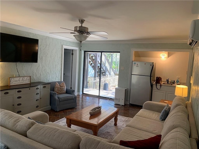 living room featuring a wall unit AC, ceiling fan, and crown molding