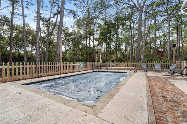 view of pool with a patio and fence private yard