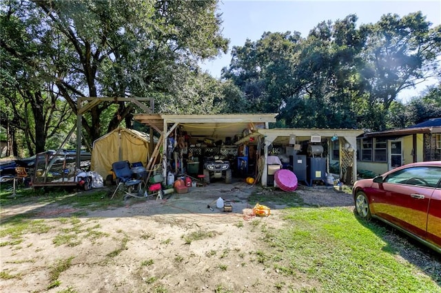 exterior space with a carport