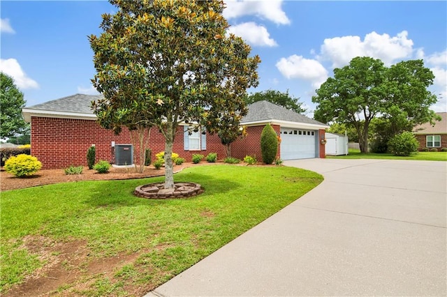 10628 Johnson Rd S, Mobile, AL 36695 - view of front of home featuring driveway, a garage, and a front yard