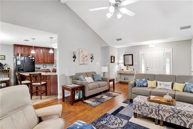 10628 Johnson Rd S, Mobile, AL 36695 - living room with high vaulted ceiling, a ceiling fan, and light wood-type flooring