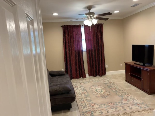 living room featuring ornamental molding and ceiling fan