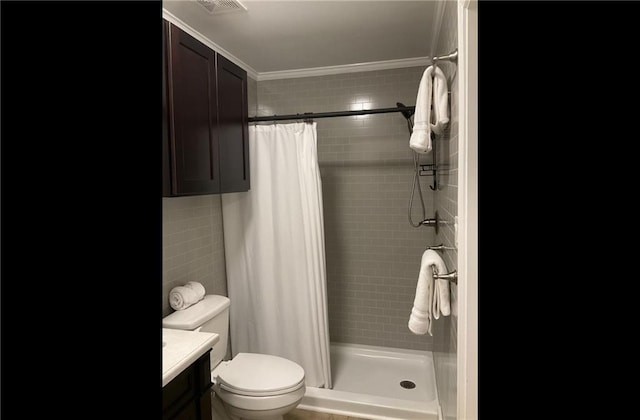 bathroom featuring toilet, curtained shower, vanity, and crown molding