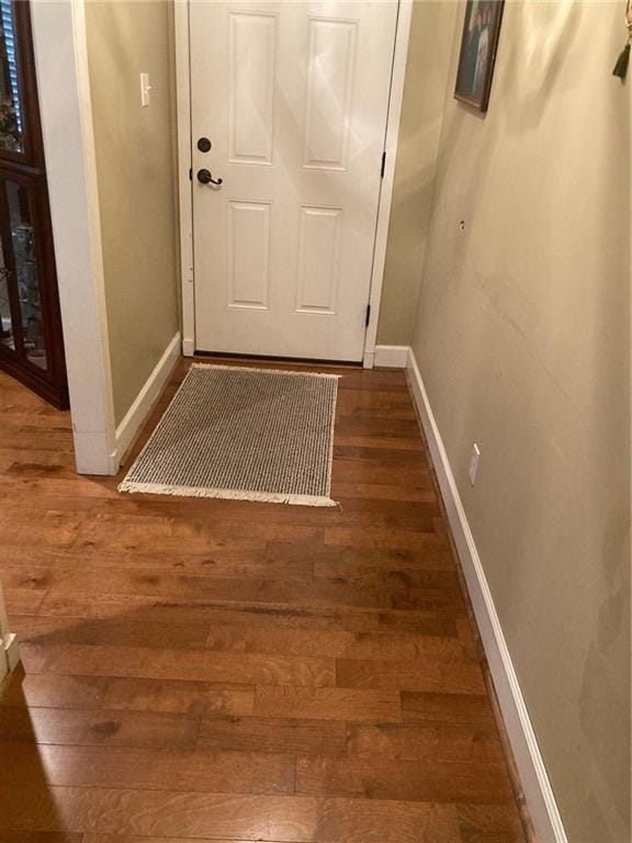 doorway featuring dark hardwood / wood-style floors