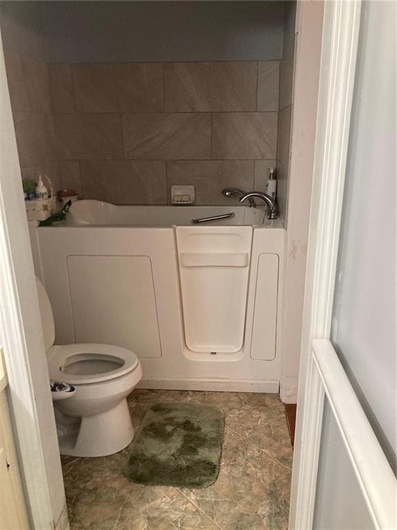 724 Mae St, Saraland, AL 36571 - bathroom featuring toilet and a garden tub