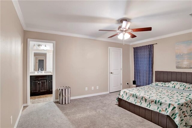 bedroom featuring crown molding, light colored carpet, ceiling fan, and ensuite bathroom