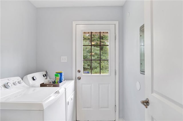 washroom featuring washing machine and dryer and a healthy amount of sunlight