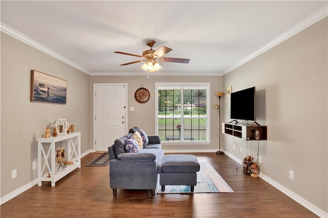 living room with crown molding, ceiling fan, and dark hardwood / wood-style floors