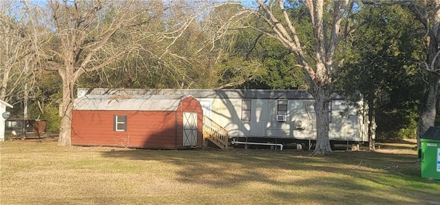 view of outdoor structure featuring a yard