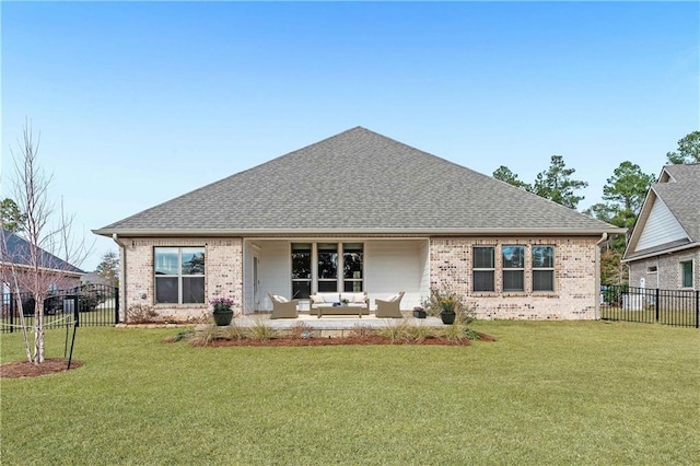 back of property with a yard and outdoor lounge area