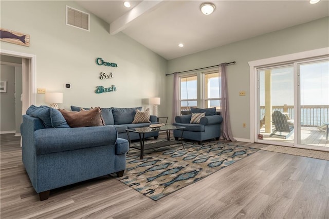 living room with beam ceiling, recessed lighting, visible vents, wood finished floors, and baseboards