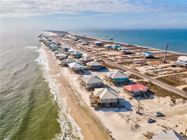 drone / aerial view featuring a view of the beach and a water view