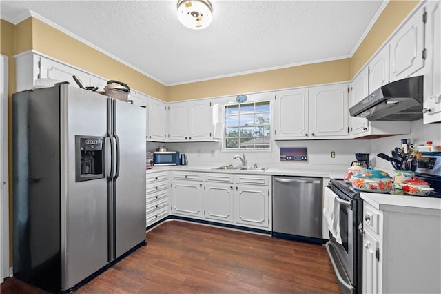 kitchen with appliances with stainless steel finishes, sink, and white cabinets