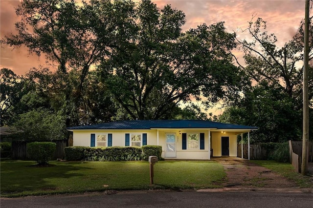 4061 Sallie Ct, Mobile, AL 36609 - ranch-style home with dirt driveway, an attached carport, and a metal roof