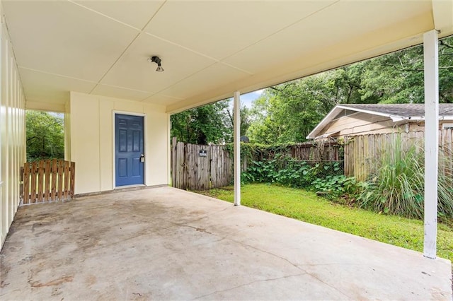 4061 Sallie Ct, Mobile, AL 36609 - fenced backyard with a patio and a carport